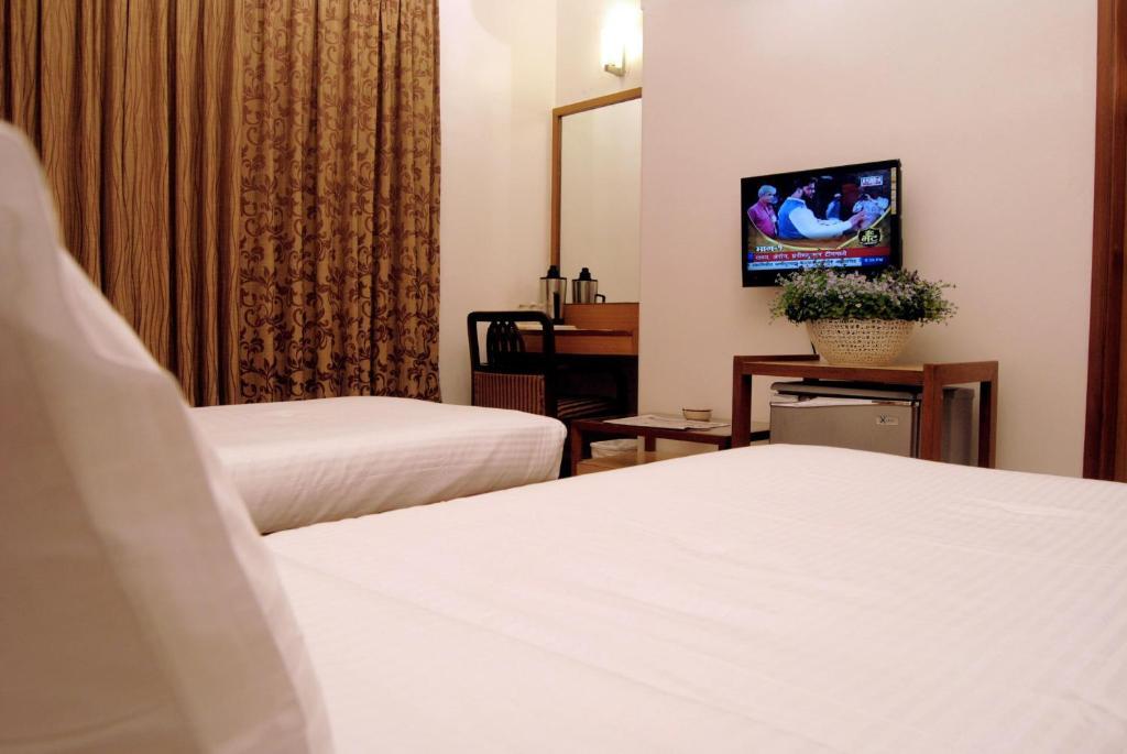The Ambience Hotel Pune Oda fotoğraf