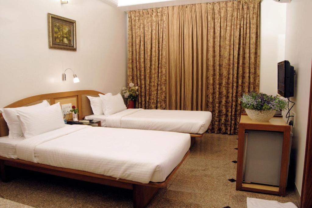 The Ambience Hotel Pune Oda fotoğraf