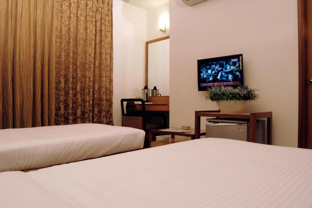The Ambience Hotel Pune Oda fotoğraf